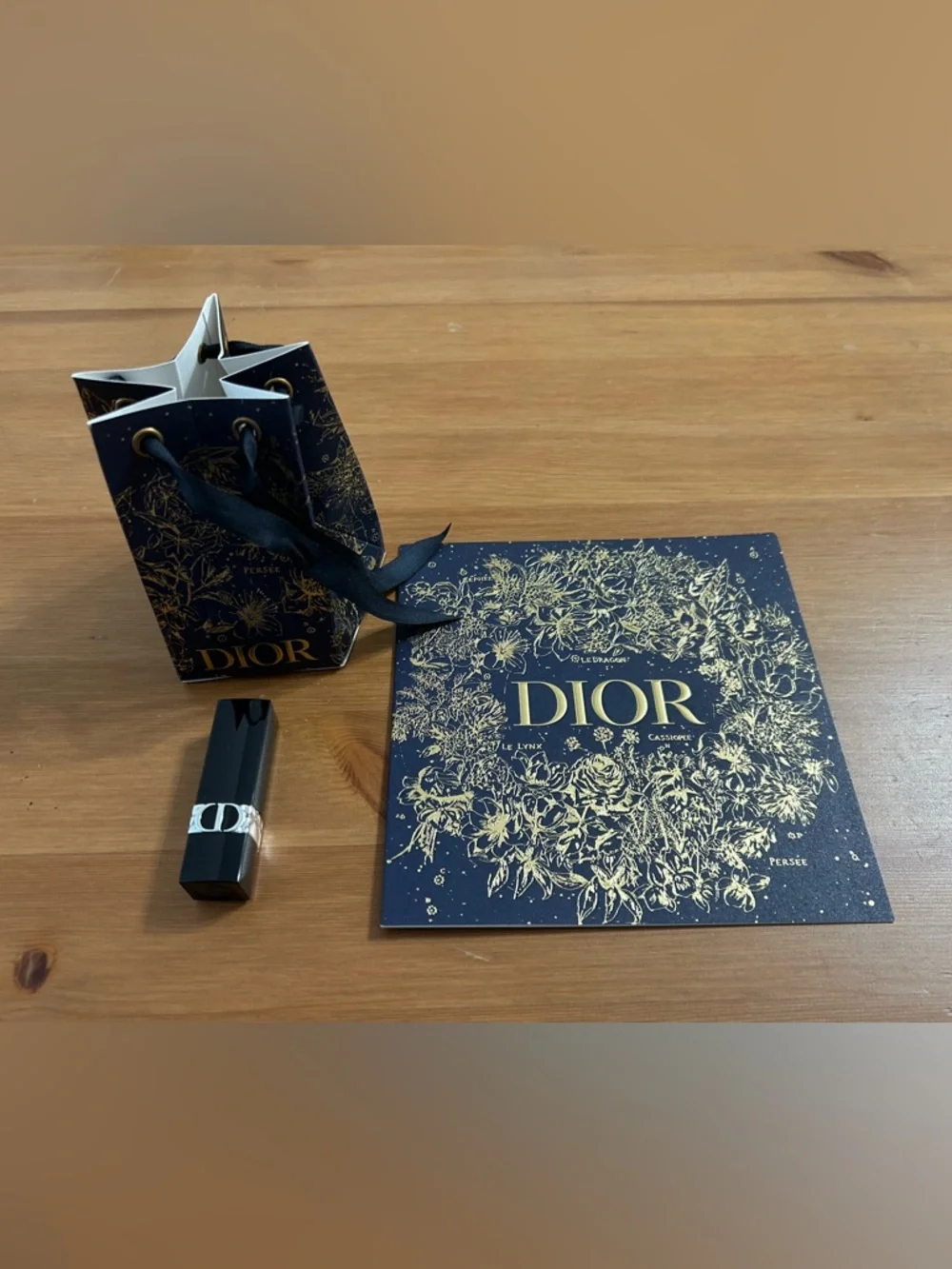 Dior rouge mini lipstick in SATIN 999 (red) with matching bauble and card